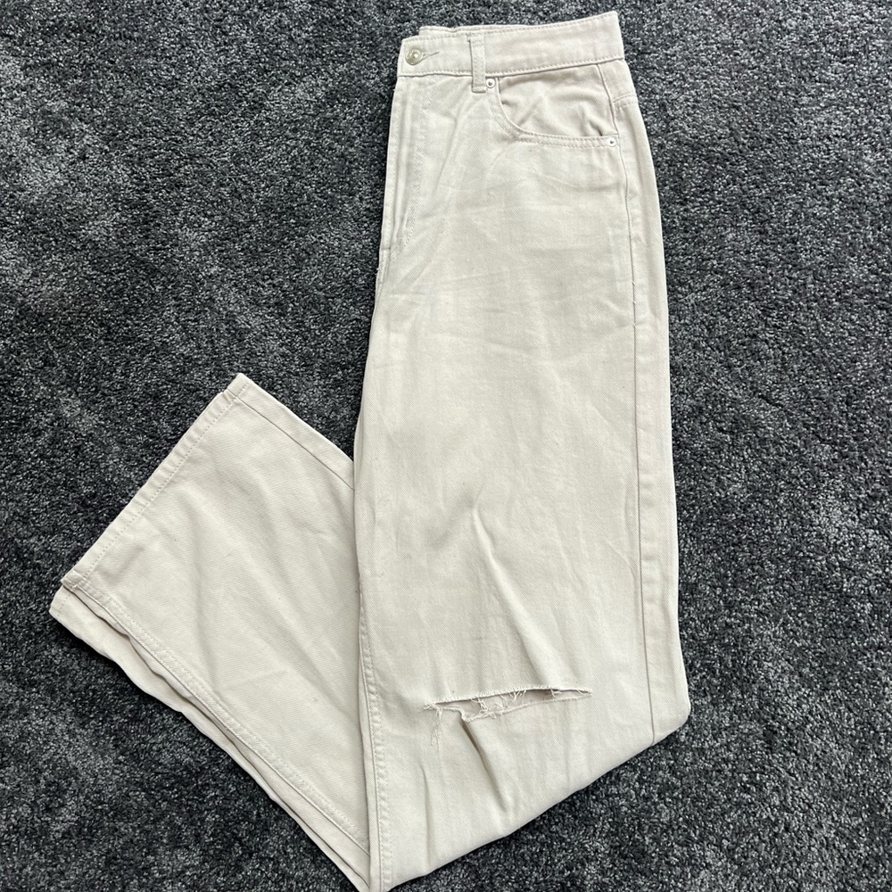 Light taupe straight leg high waisted jeans with slit in knees
